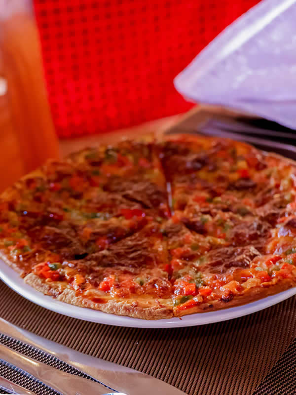 Fresh pizza served at Penety Amboseli Resort restaurant